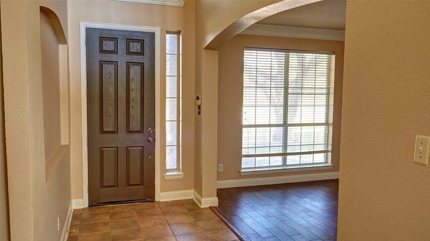 Welcome to this spacious 6-bedroom, 3.5-bath home in one of The - photo 5