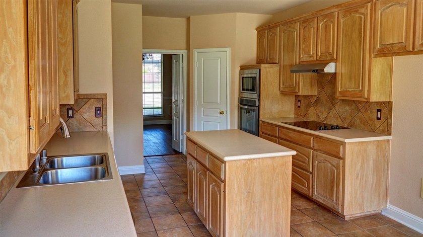 Welcome to this spacious 6-bedroom, 3.5-bath home in one of The - photo 10