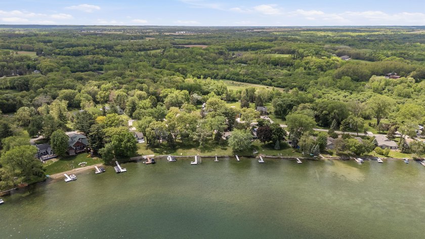 65 ft of level frontage on beautiful Pretty Lake with sunrise - photo 16