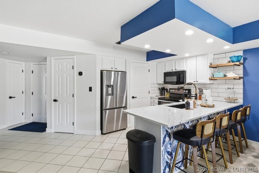 Enjoy the best of lake living in this beautifully renovated 3 - photo 3