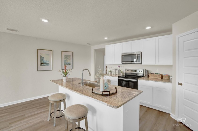 The Cali is an attractive one-story home with a spacious two-car - photo 11