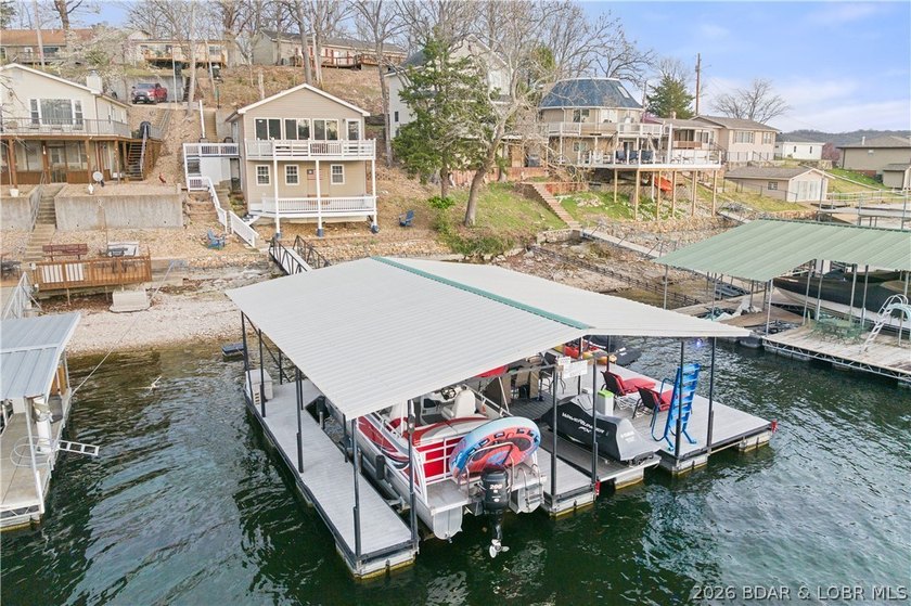 Discover the ultimate lakefront retreat with this stunningly - photo 3