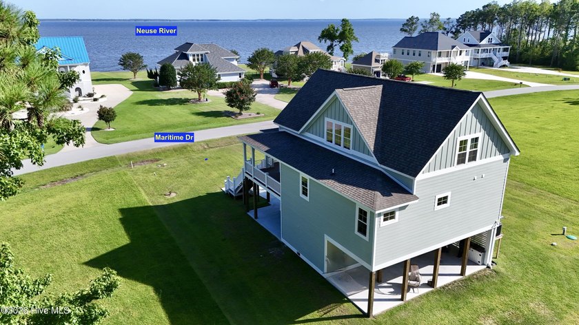 Discover elevated coastal living in Whittaker Point, one of - photo 3