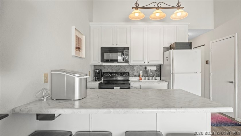Experience the ultimate lake lifestyle at Heron Bay, a premier - photo 7