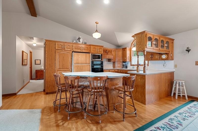 Beautiful arched-window entry welcomes you to this inviting lake - photo 16