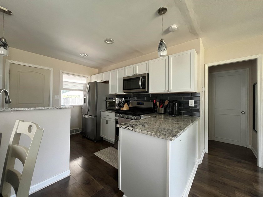 Beautifully updated and move-in ready, this charming 2 bed, 1 - photo 13