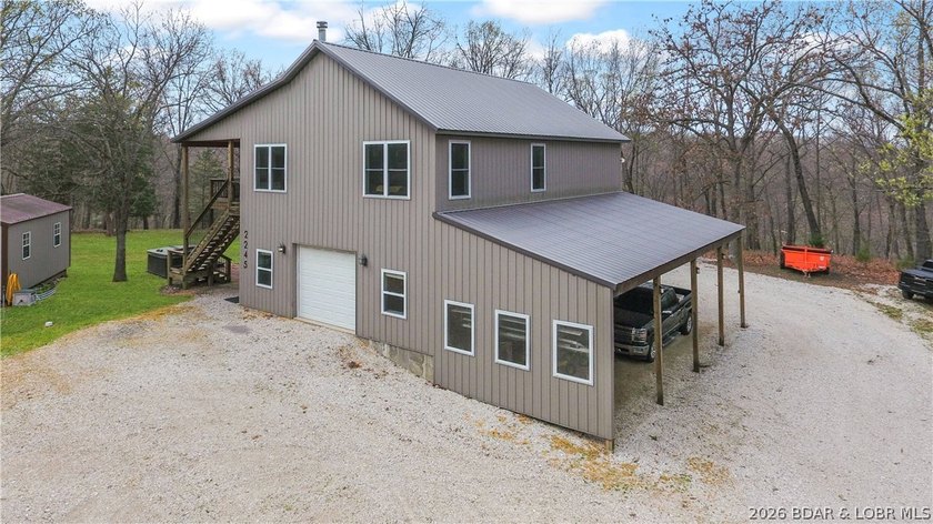 Situated on 4.43 acres just minutes from Camdenton, this - photo 3