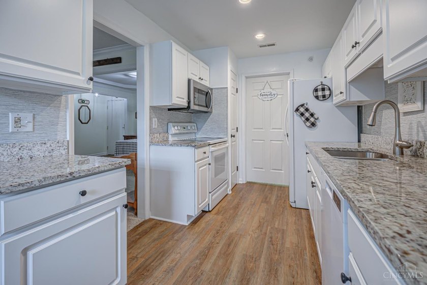 Welcome home to easy, low-maintenance living in the beautifully - photo 10
