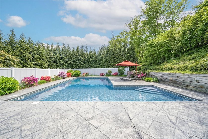 Set within the serene landscape of Rolling Woods in Riverhead - photo 8