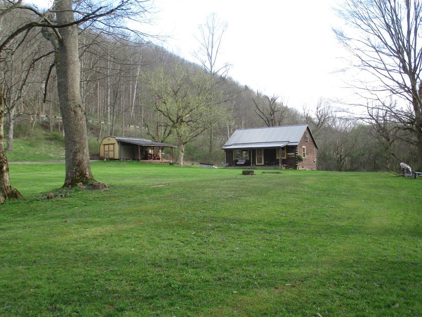 This log home is sitting on 2.27 acres, more or less, and is - photo 3