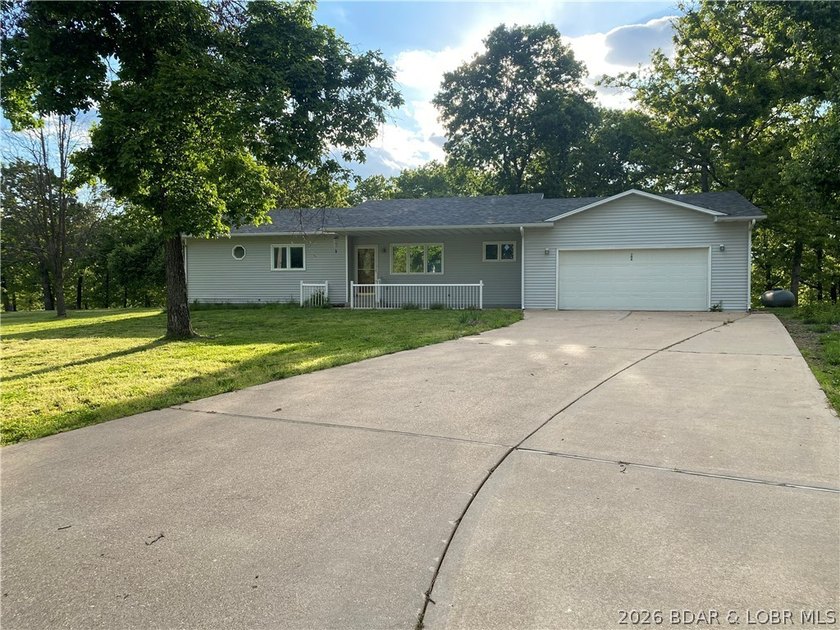 This home checks a lot of boxes: Location, blacktop to your door - photo 2