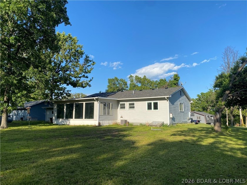 This home checks a lot of boxes: Location, blacktop to your door - photo 4