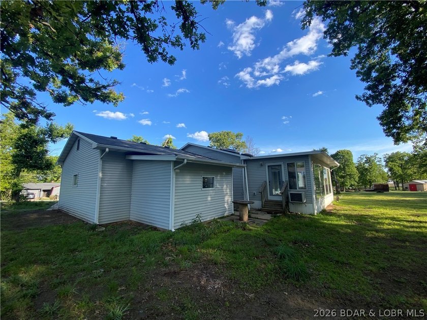 This home checks a lot of boxes: Location, blacktop to your door - photo 5
