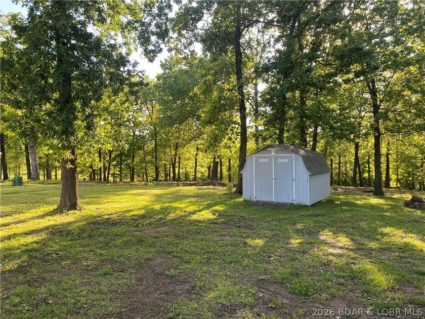 This home checks a lot of boxes: Location, blacktop to your door - photo 6