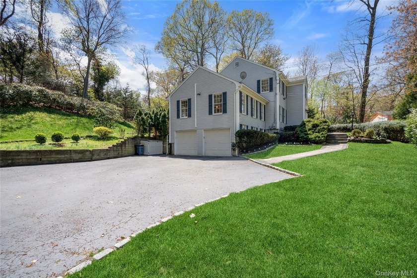 Nestled on a secluded, lushly landscaped three-quarter-acre - photo 3