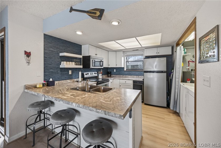 Welcome to this beautifully updated lakefront condo in one of - photo 3