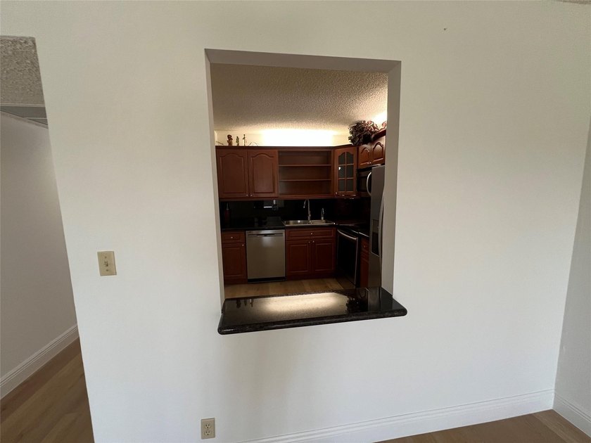 Top floor, corner unit.. Enclosed balcony with brand new Impact - photo 13