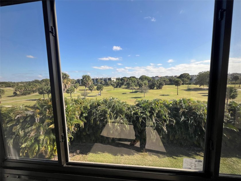Top floor, corner unit.. Enclosed balcony with brand new Impact - photo 20