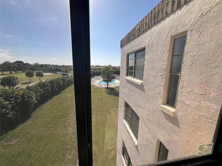 Top floor, corner unit.. Enclosed balcony with brand new Impact - photo 24