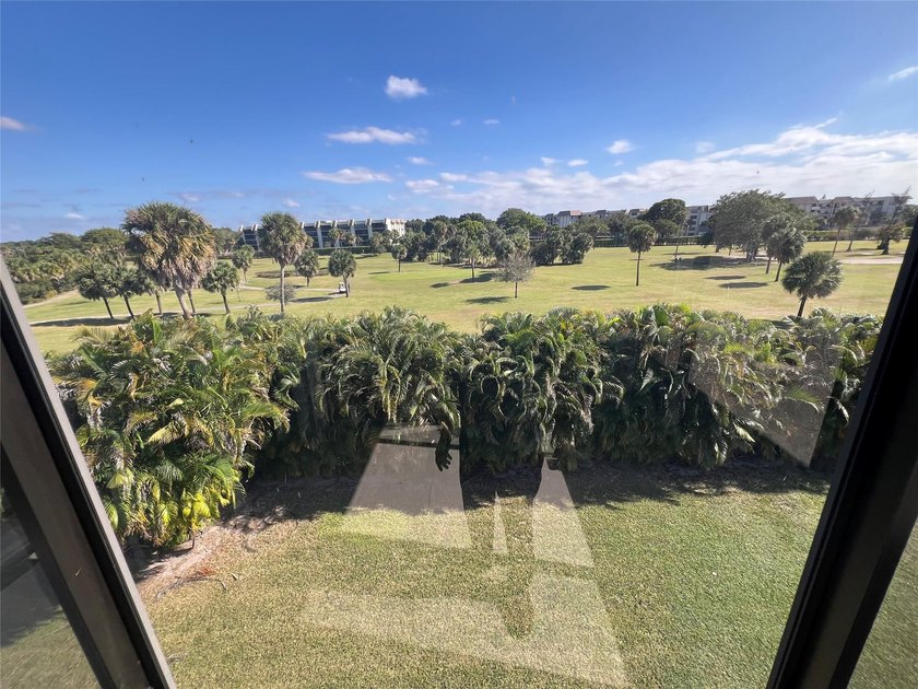 Top floor, corner unit.. Enclosed balcony with brand new Impact - photo 29