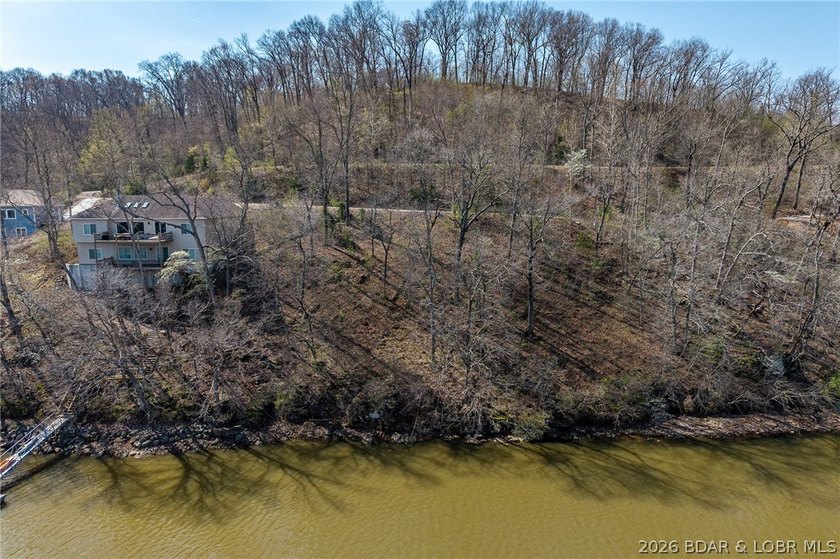 Lake Front lot ready for your dream home build! Located at the - photo 3