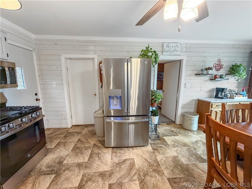 Lake of the Ozarks waterfront property featuring natural stone - photo 9