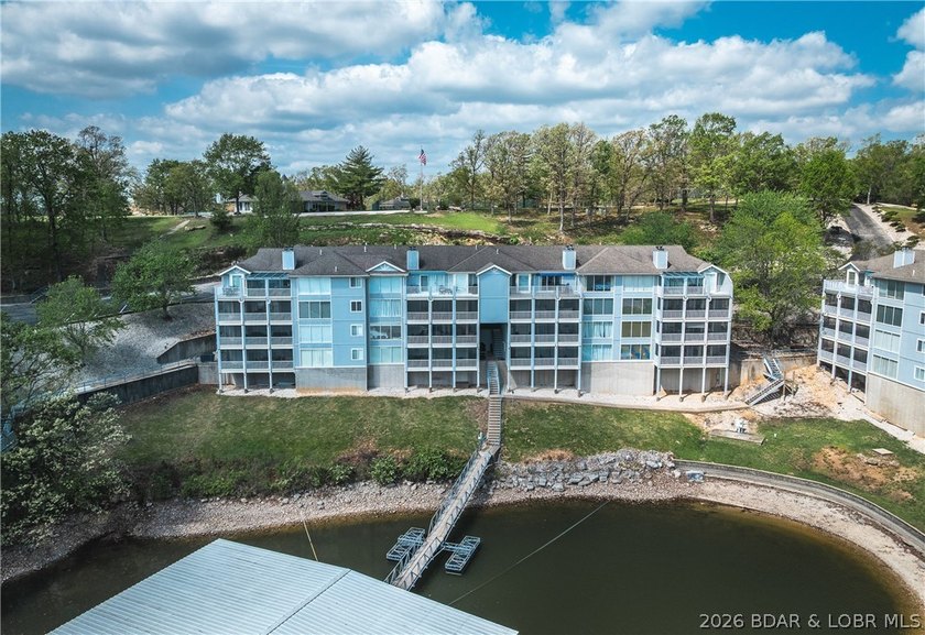 Enjoy stunning lake views from your screened-in deck overlooking - photo 2
