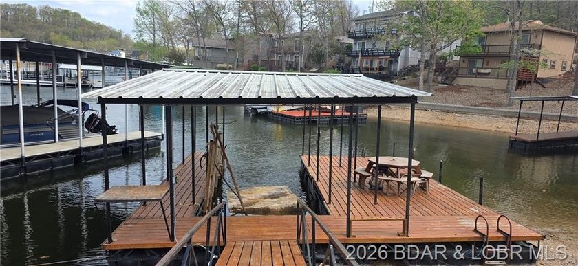 Large lakefront family home tucked back in a protective cove for - photo 2