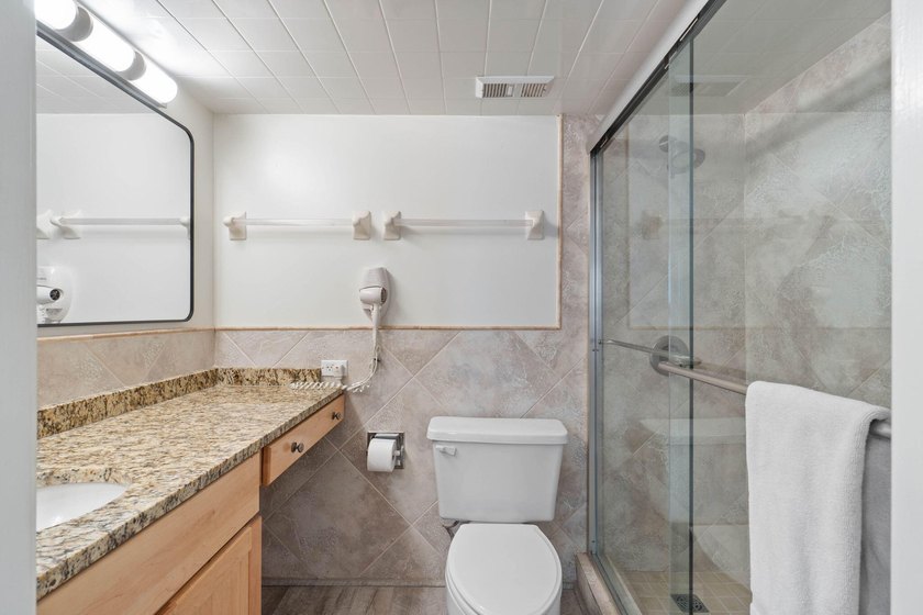Experience elevated coastal living from this penthouse-level - photo 19