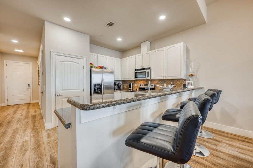 Discover the ultimate retreat in this updated Penthouse-level - photo 17