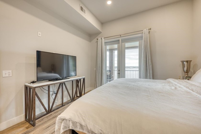 Discover the ultimate retreat in this updated Penthouse-level - photo 27
