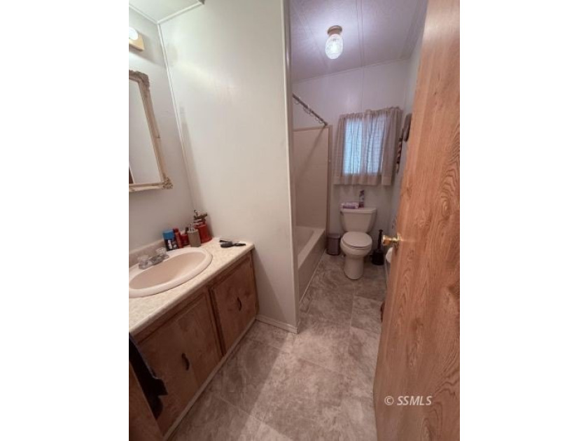 This inviting 1984 manufactured home, set on a permanent - photo 24