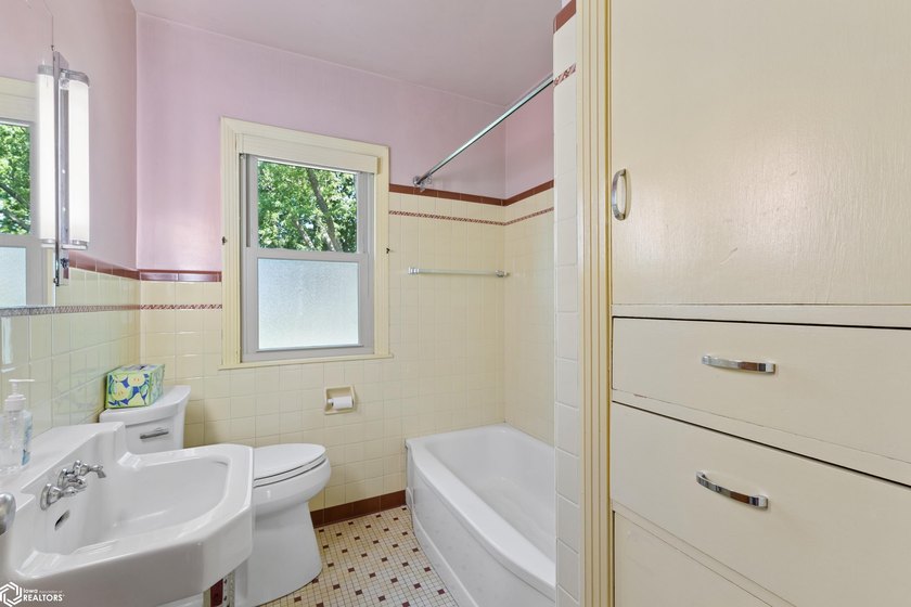 *The Pheasant House on Main* Step into timeless charm with this - photo 13