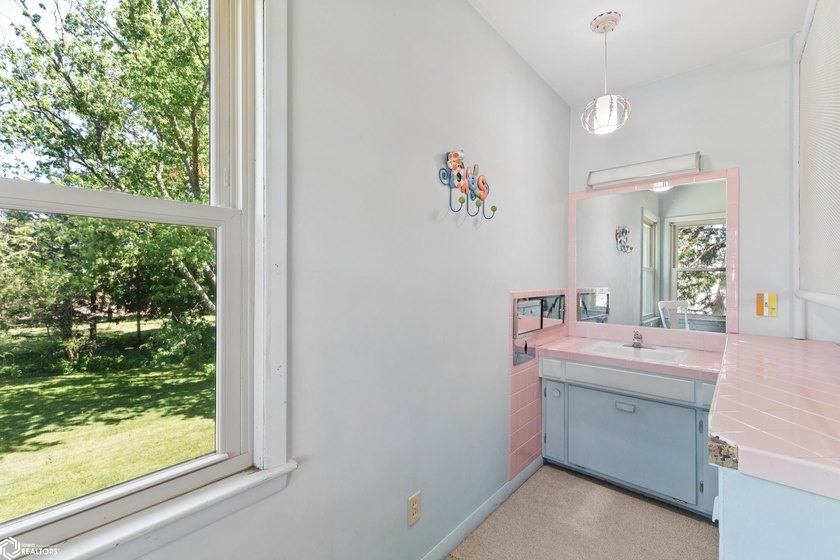 *The Pheasant House on Main* Step into timeless charm with this - photo 32
