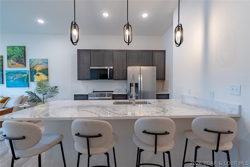 Enjoy the perfect blend of elevation and convenience in this - photo 7