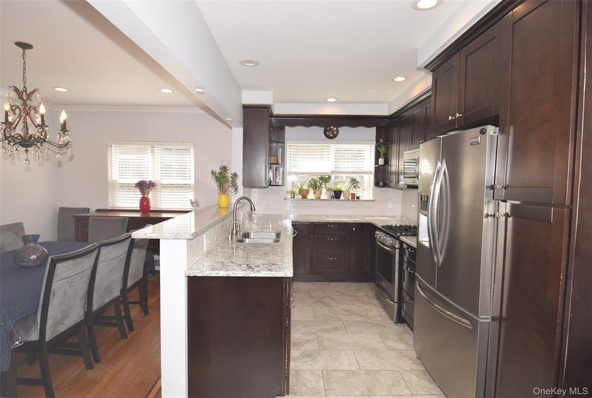 Welcome to this beautifully renovated semi-detached home in the - photo 7