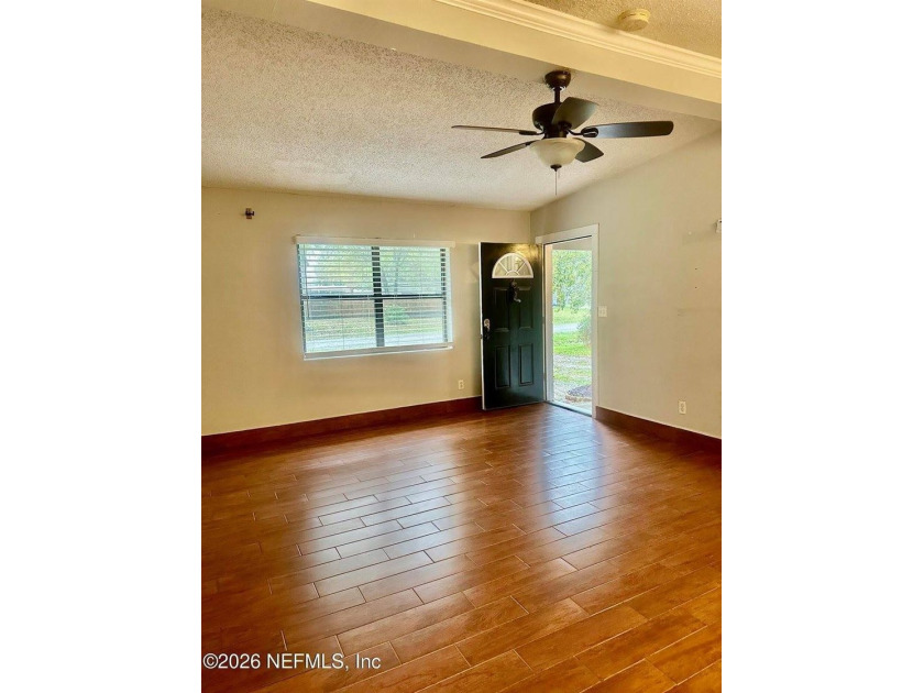 Charming 3BR/1BA concrete block home with major updates and a - photo 3