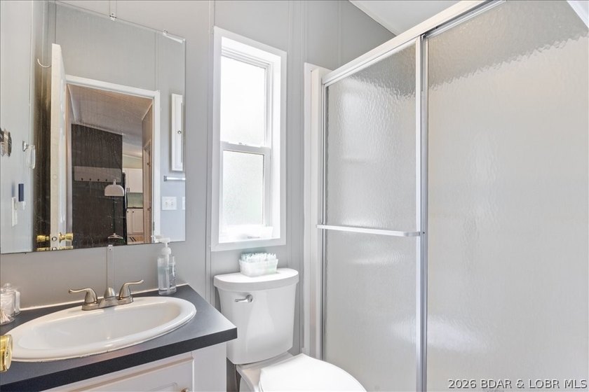 Discover this beautifully updated 4-bedroom, 3-bath lakefront - photo 12
