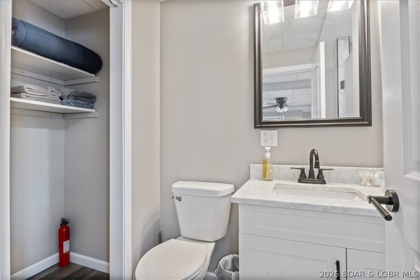 Discover this beautifully updated 4-bedroom, 3-bath lakefront - photo 21