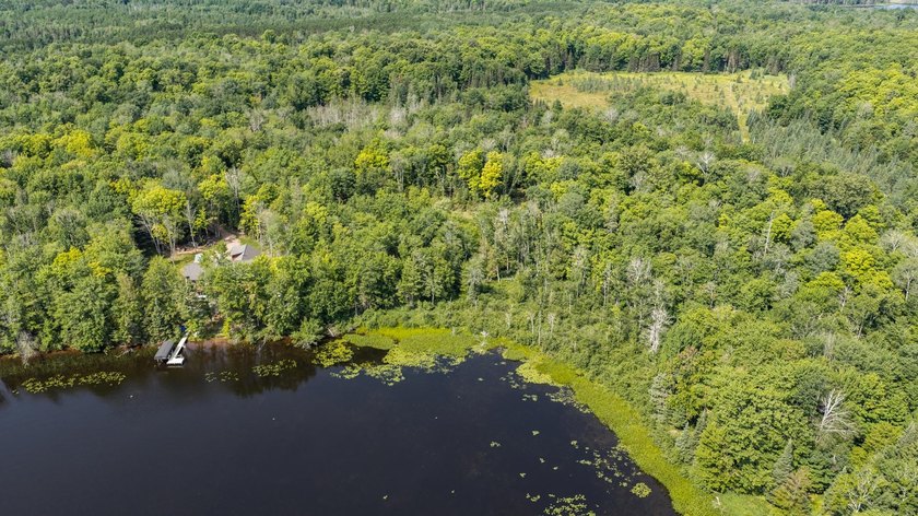 Exceptional opportunity to own 4.4 wooded acres with 326 feet of - photo 11
