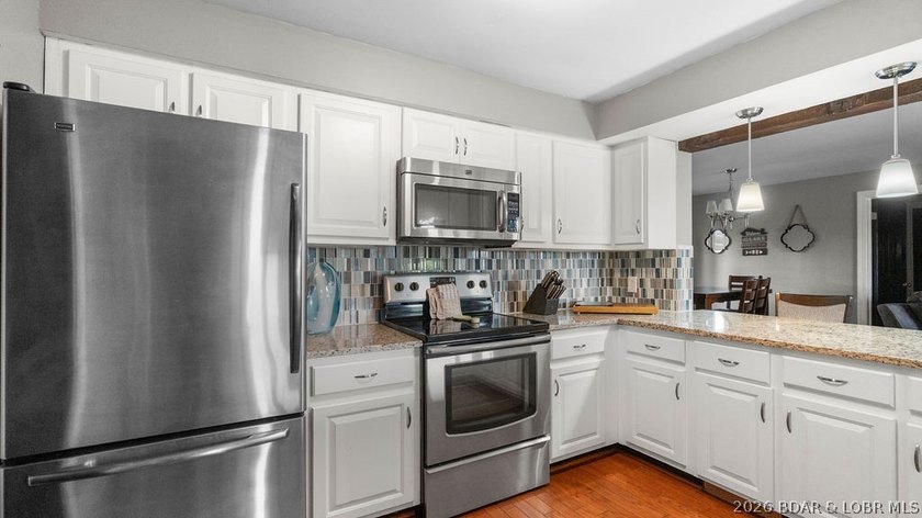 Turnkey Lakefront Living with a Dock Slip Included! Discover - photo 4