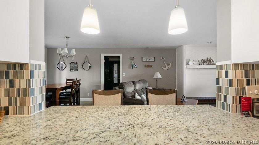 Turnkey Lakefront Living with a Dock Slip Included! Discover - photo 5