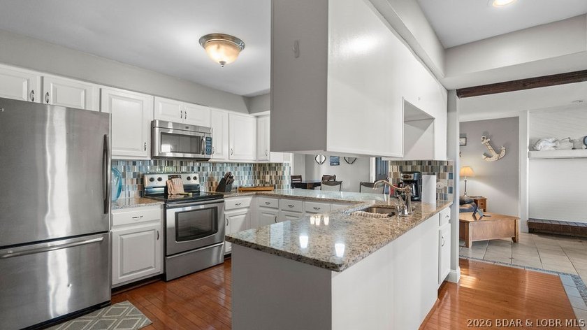 Turnkey Lakefront Living with a Dock Slip Included! Discover - photo 6
