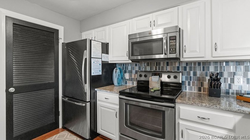 Turnkey Lakefront Living with a Dock Slip Included! Discover - photo 7