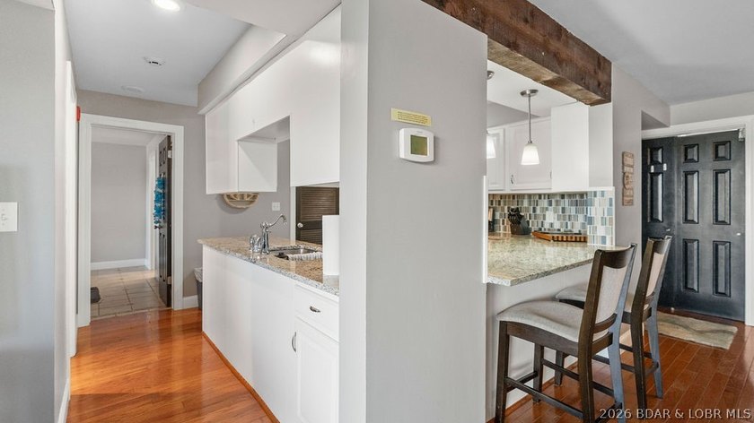 Turnkey Lakefront Living with a Dock Slip Included! Discover - photo 9