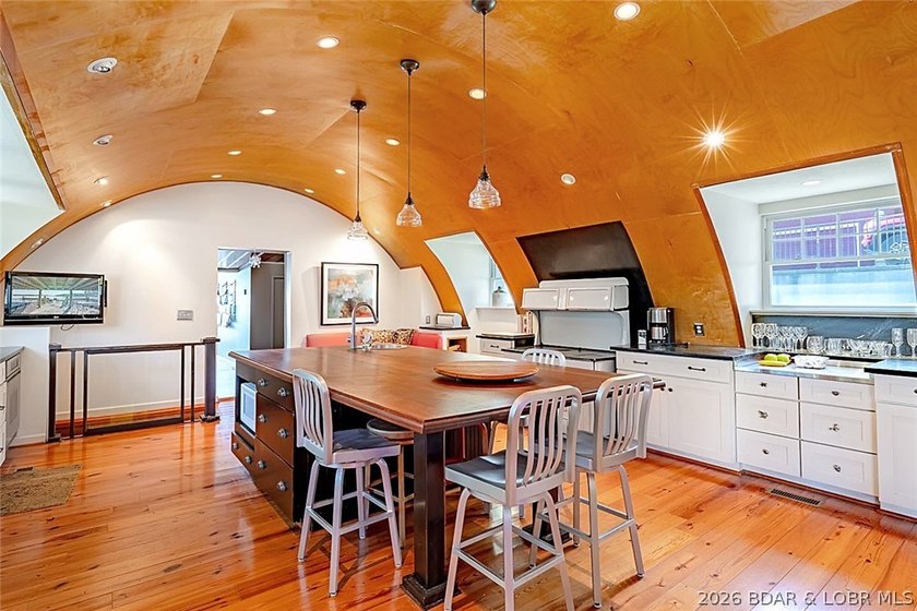 Originally a Quonset hut, this unique lakefront property blends - photo 8