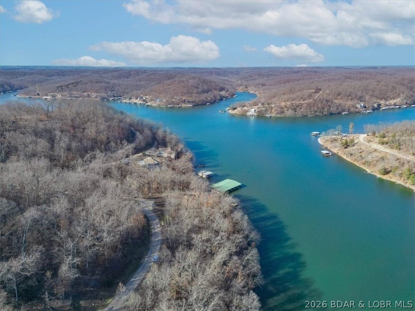 Prime 1.3-Acre Lakefront Canvas: Build Your Dream at Eagle Bay! - photo 3