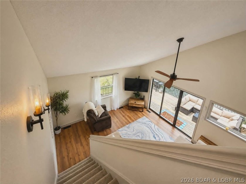 Step inside to vaulted ceilings and a stunning primary suite - photo 3