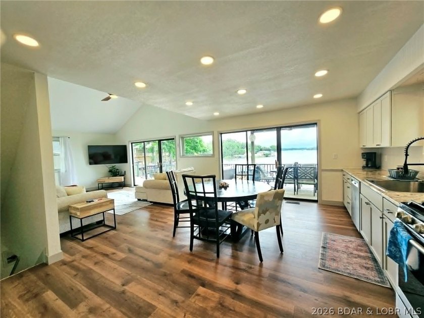 Step inside to vaulted ceilings and a stunning primary suite - photo 5