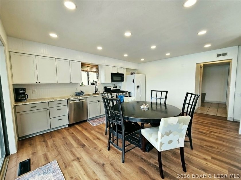Step inside to vaulted ceilings and a stunning primary suite - photo 6